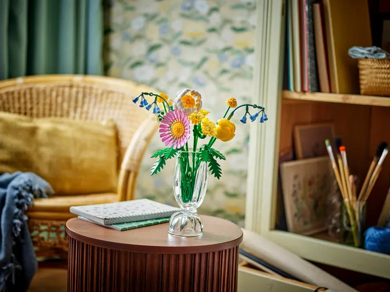 LEGO Botanicals Petite Sunny Bouquet 10347 displayed in a clear vase on a table