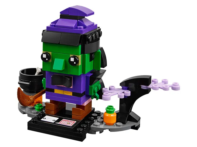 LEGO® BrickHeadz 40272 Halloween Witch features green skin, decorated eyes, pointy hat and a detachable broom.