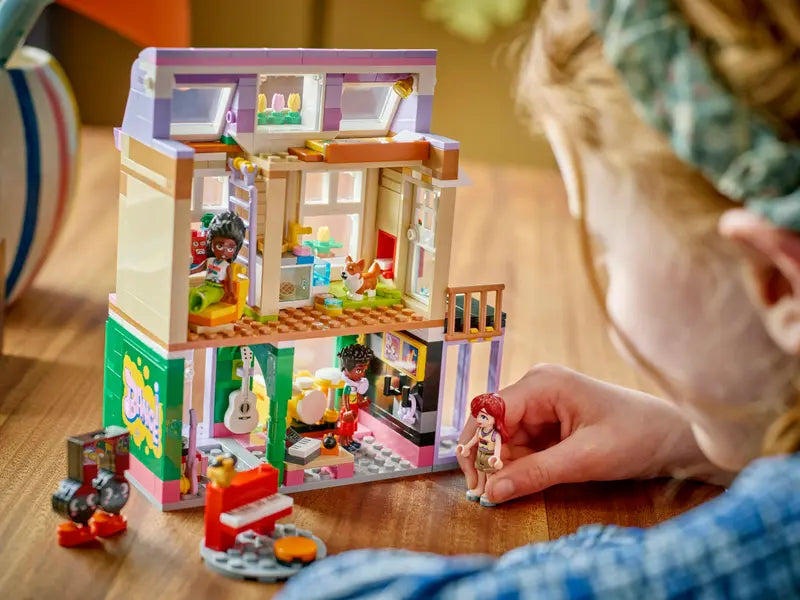 Kid Playing with LEGO Friends Music Shop & Apartment 42653