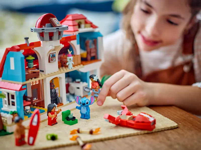 Kid playing with LEGO Disney Lilo and Stitch Beach House 43268