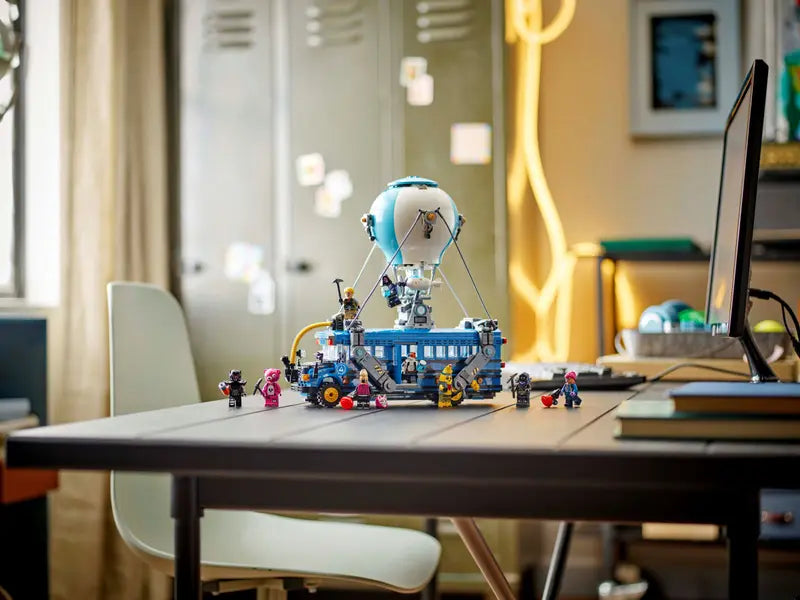 LEGO Fortnite Battle Bus 77073 with minifigures displayed on a desk