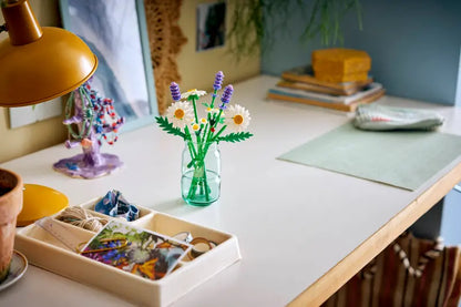 LEGO® Botanicals Daisies 11508 displayed in a clear vase on a table