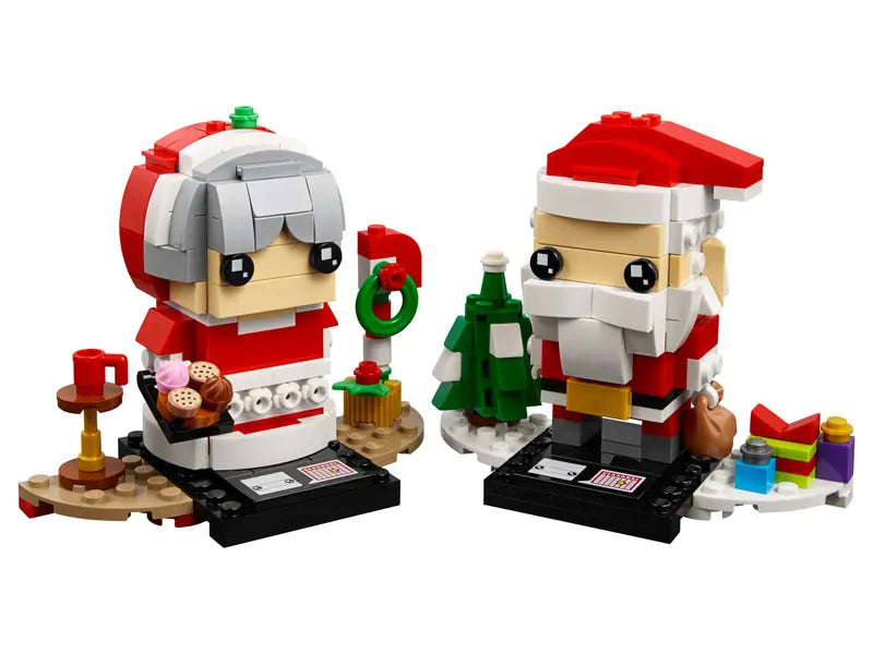 LEGO 40274 Mr. & Mrs. Claus includes detachable gift sack, assorted cake and cookie elements, buildable tree and a pile of gifts
