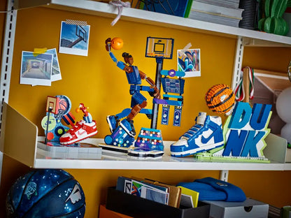 LEGO Nike basketball collection displayed on a shelf, including buildable sneakers, basketball player, hoop, and trickshot sets.