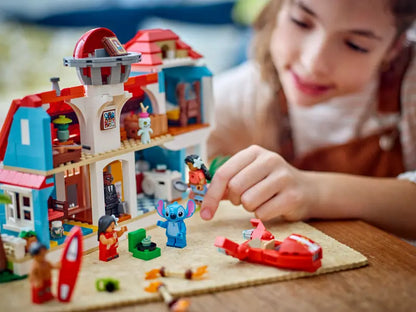 Kid playing with LEGO Disney Lilo and Stitch Beach House 43268
