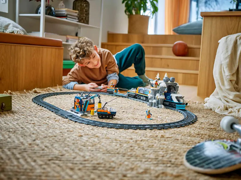 Kid playing with LEGO® City Explorers’ Arctic Polar Express Train 60470