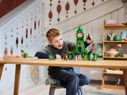 A kid playing with LEGO® Wicked 75684 Welcome to Emerald City