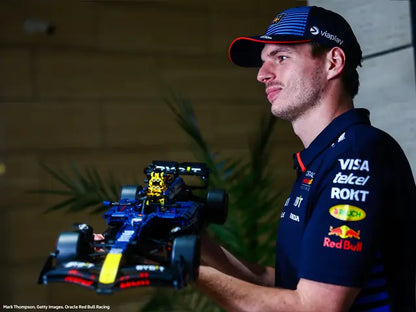 Max Verstappen holding a LEGO® Technic™ 42206 Oracle Red Bull Racing RB20 F1 Car 